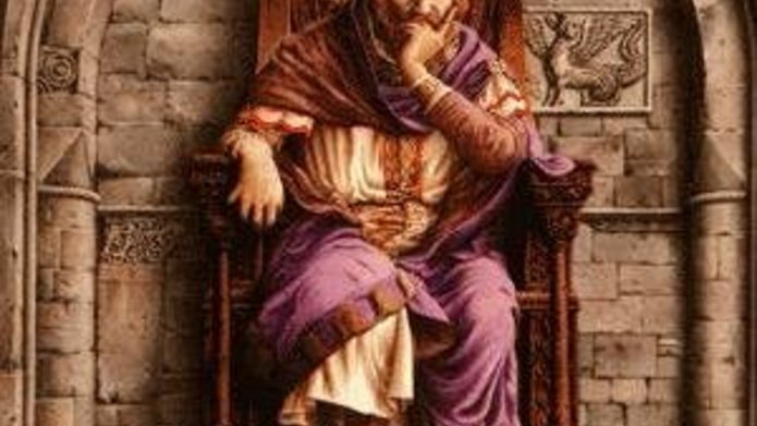 King Arthur seated on a throne